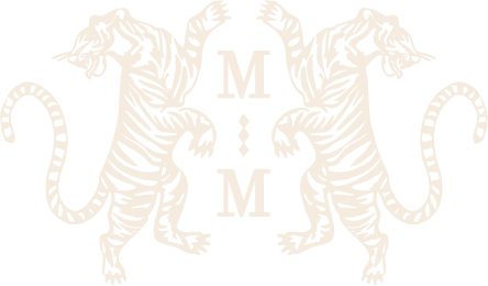 a white tiger with the letter m on it
