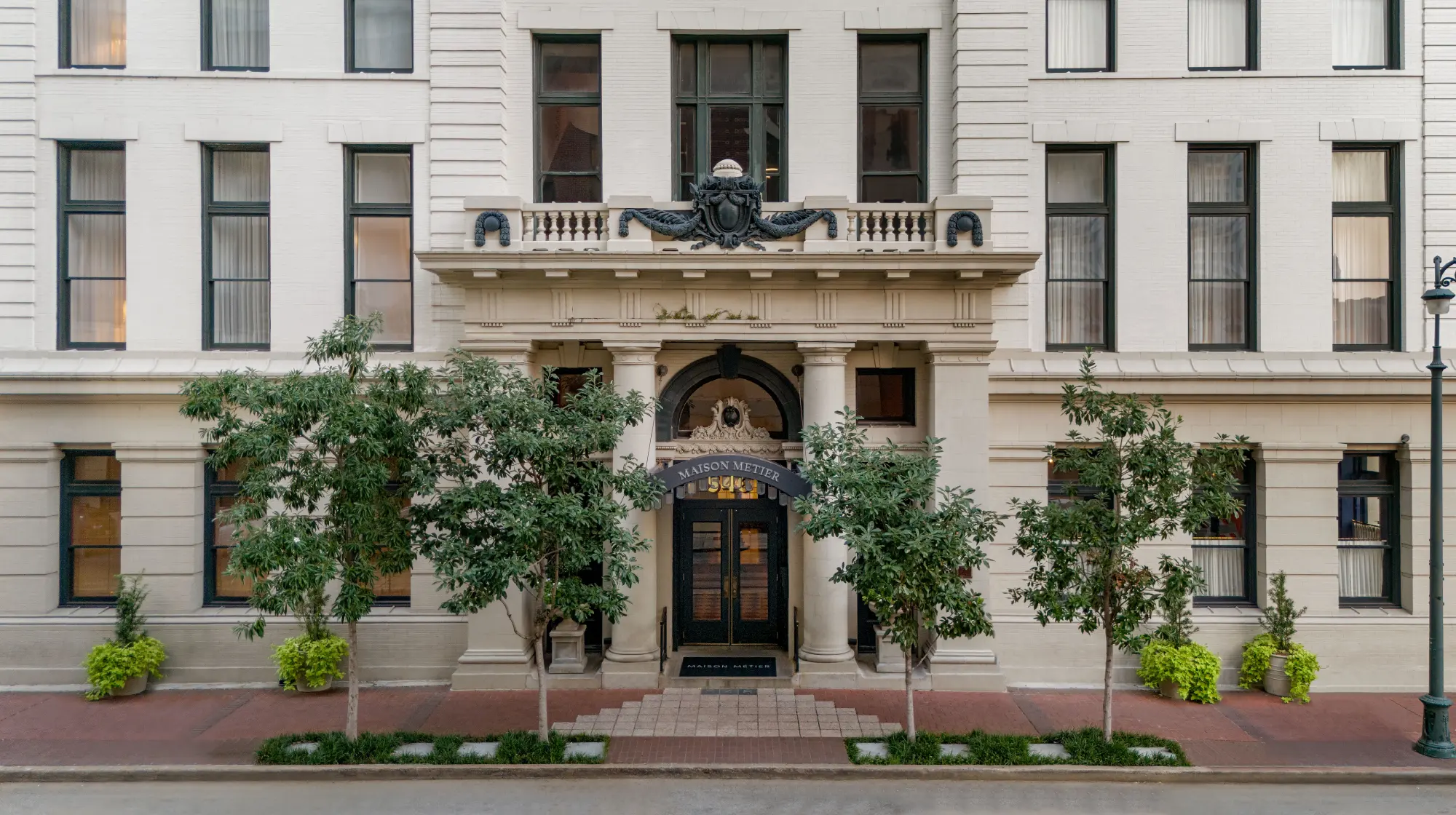 a large white building with a black door